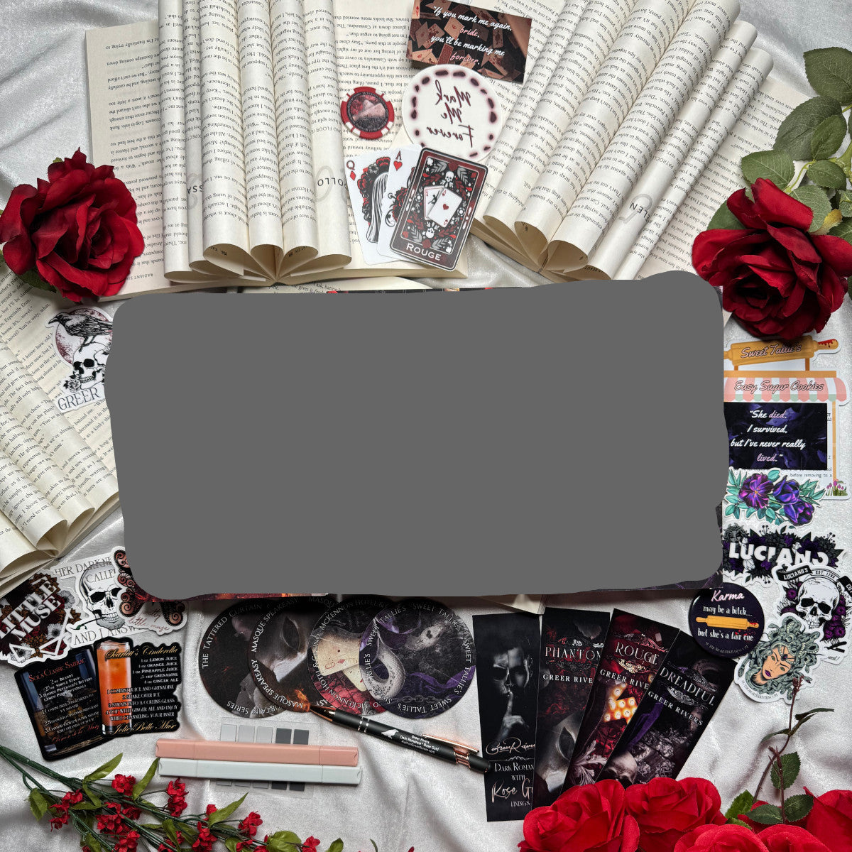 Assembled SWAG for the Tattered Curtain series. This includes bookmarks, coasters, pens, highlighters, stickers, and more.